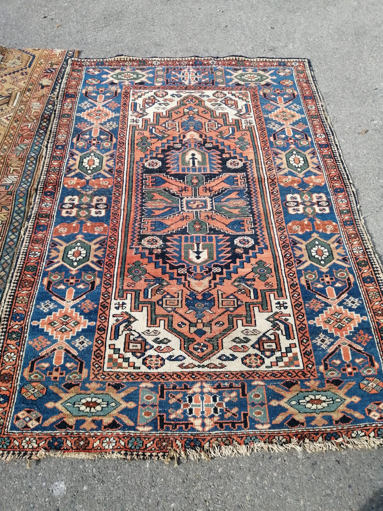 Two Caucasian rugs, red ground with central medallion, 198 x 134cm, the other 227 x 112cm